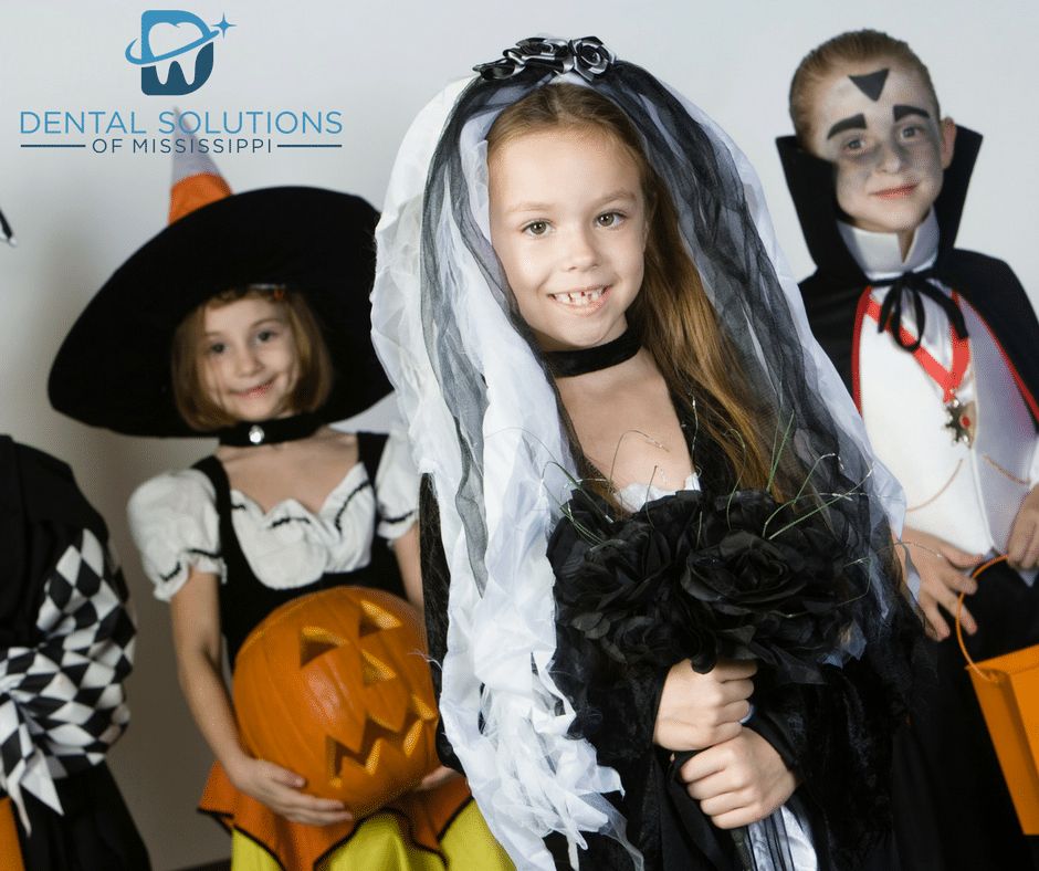 kids wearing Halloween costumes Dental Solutions of Mississippi dentist in Canton MS Dr. Ruth Roach Morgan Dr. Jessica Morgan